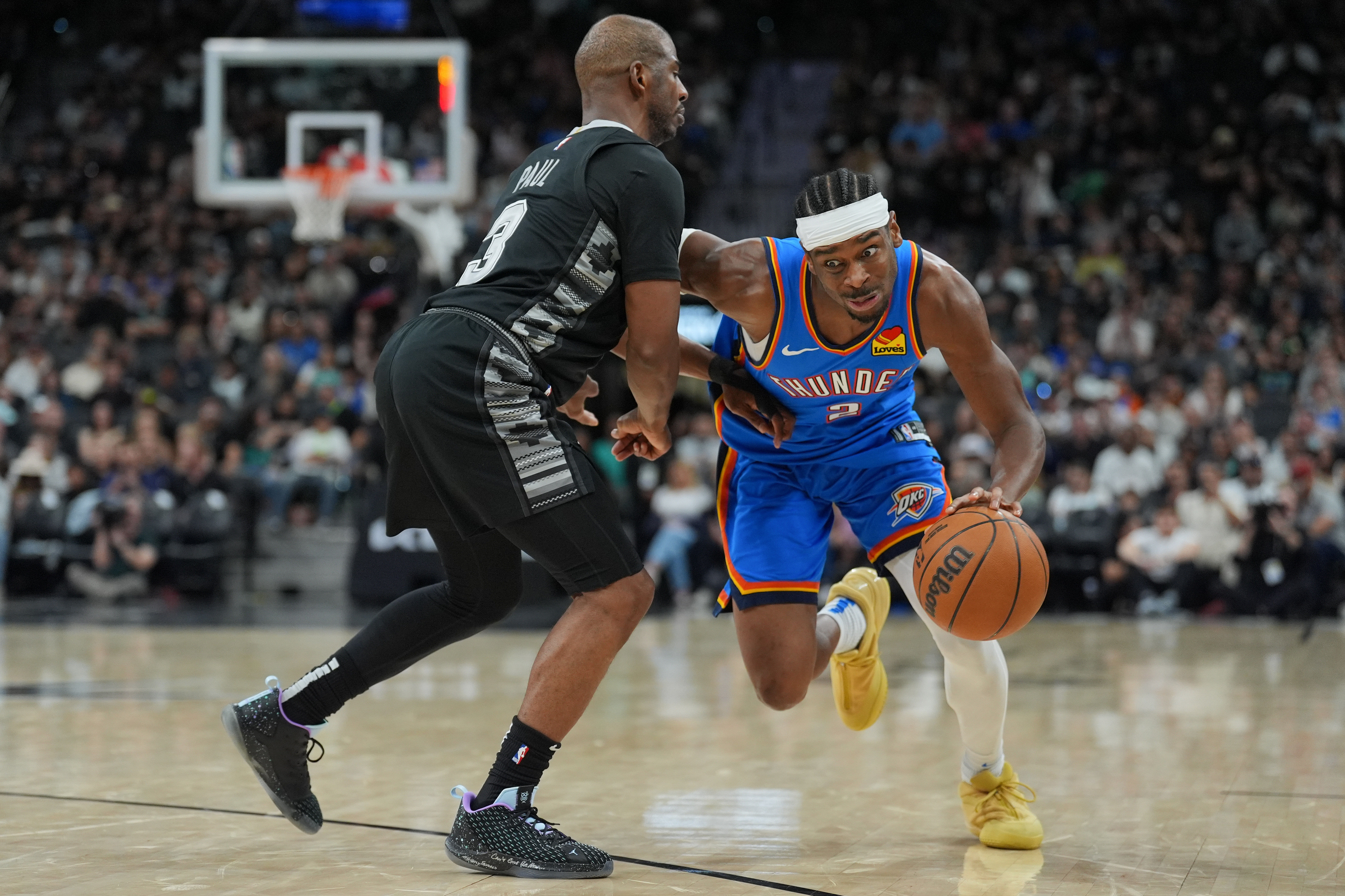 Oklahoma City Thunder guard Shai Gilgeous-Alexander (2) dribbles against San Antonio Spurs guard Chris Paul - Source: Imagn
